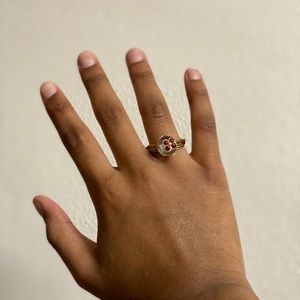 gold wire ring with burgundy stone